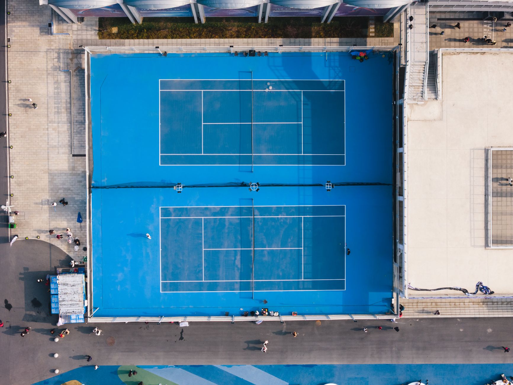 Aerial view of blue and green hard tennis courts