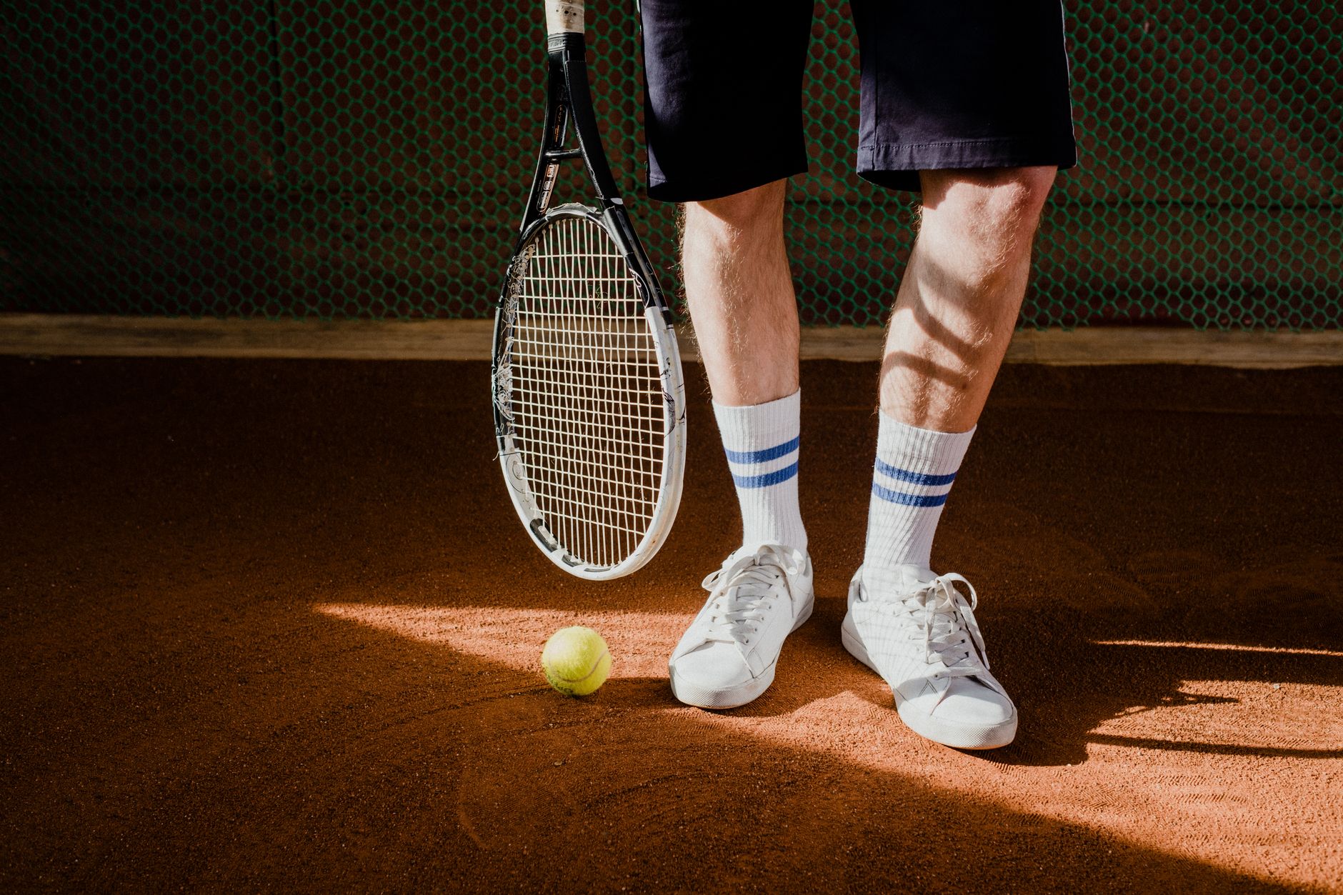 Close-up of tennis shoes worn on court