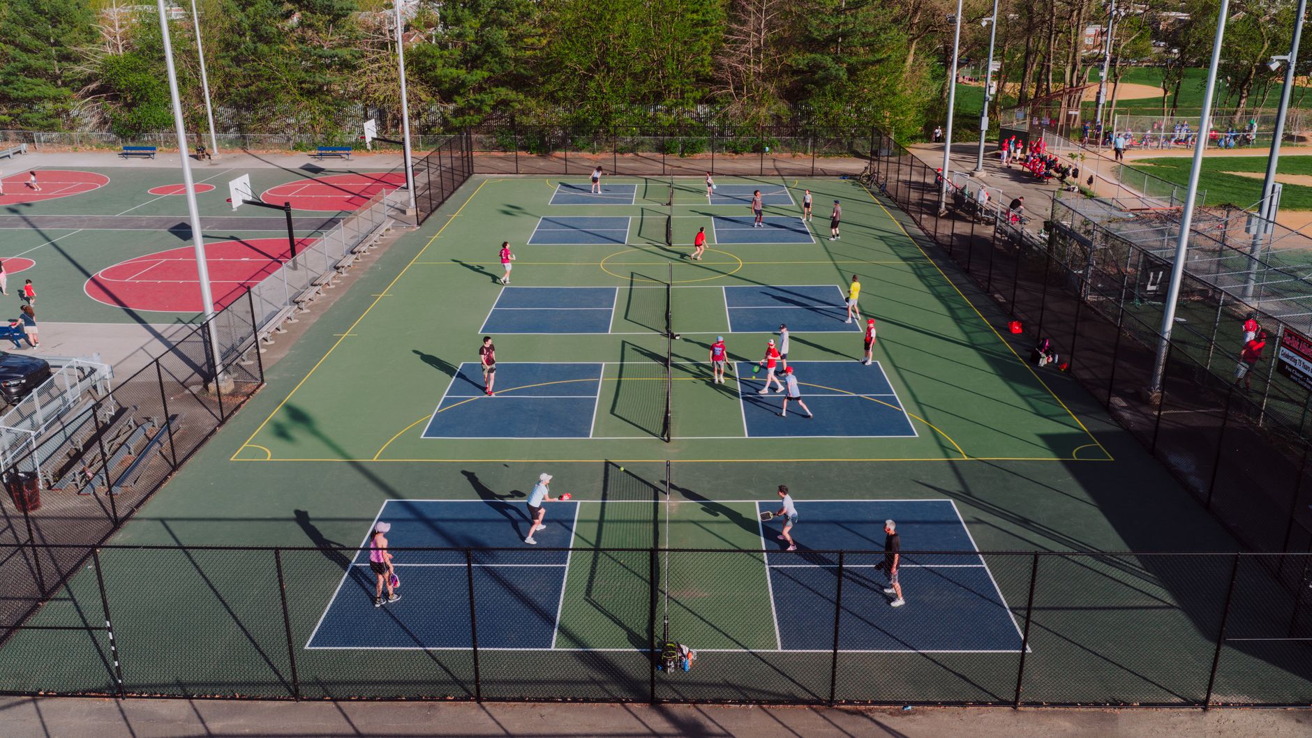 Aerial view of outdoor pickleball courts in use
